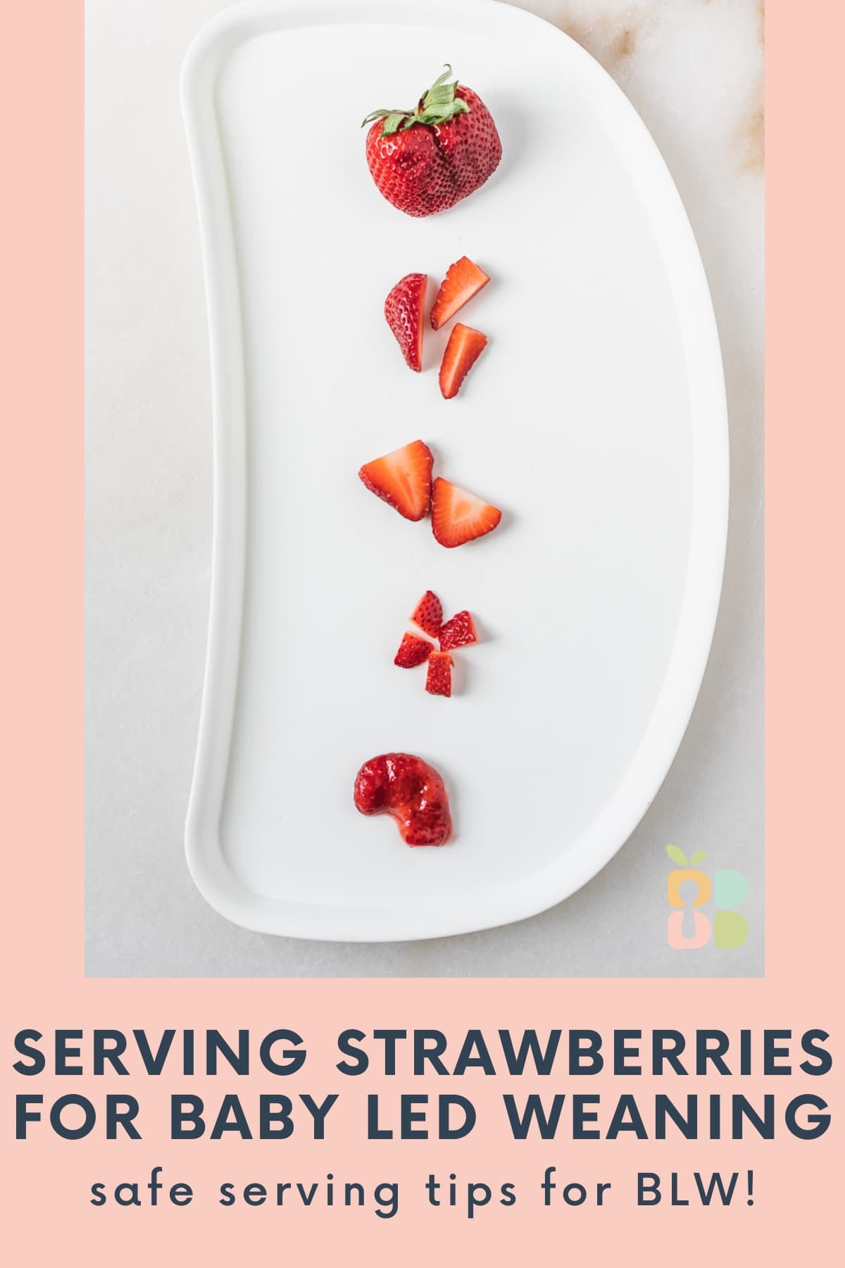 baby high chair tray with different ways of serving strawberries lined up on it with text overlay.
