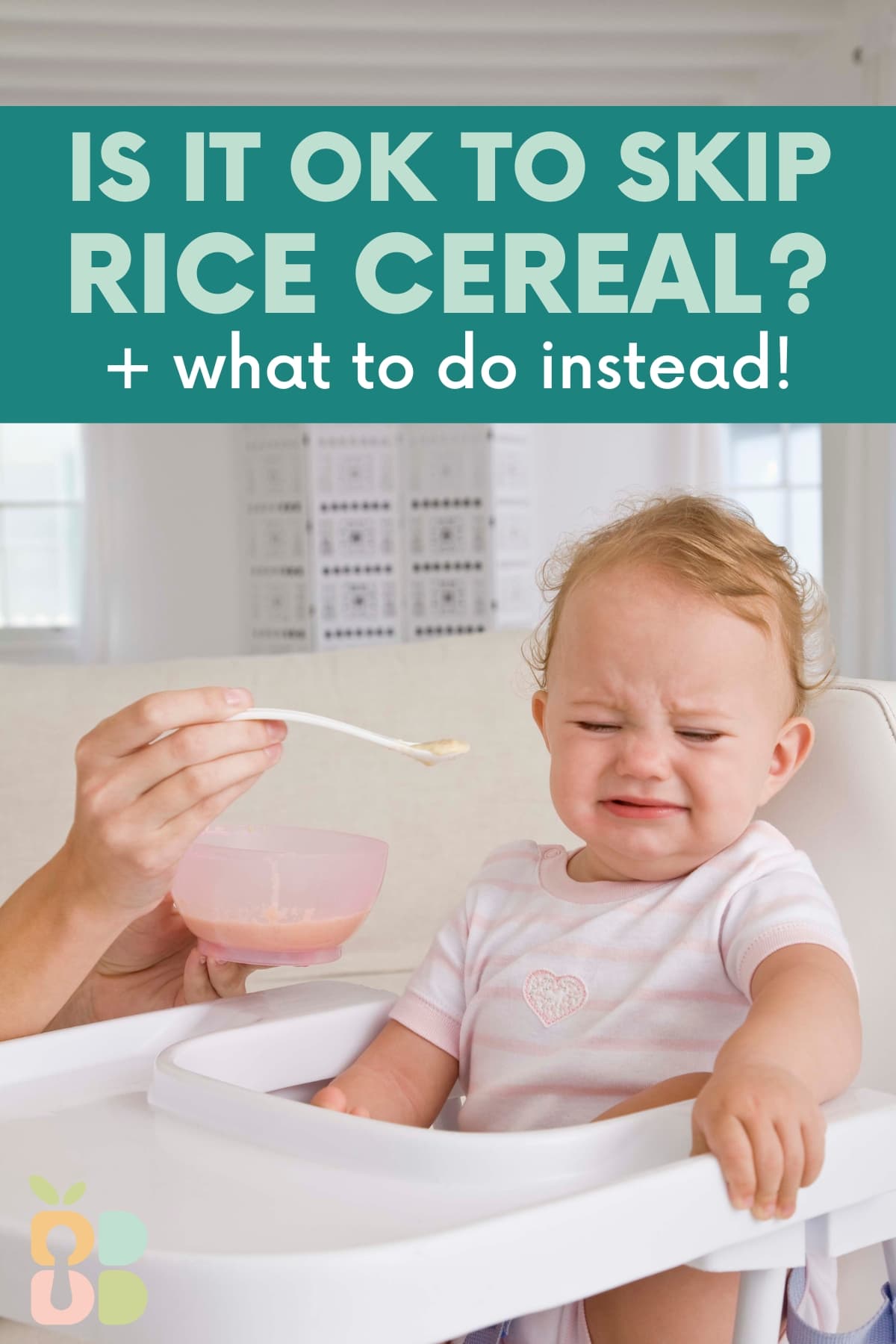 adult hands holding a baby bowl and offering spoonful of food to baby in a high chair with upset scrunched face with text overlay.