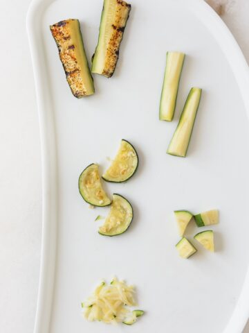 baby tray with 5 ways of serving zucchini to babies.