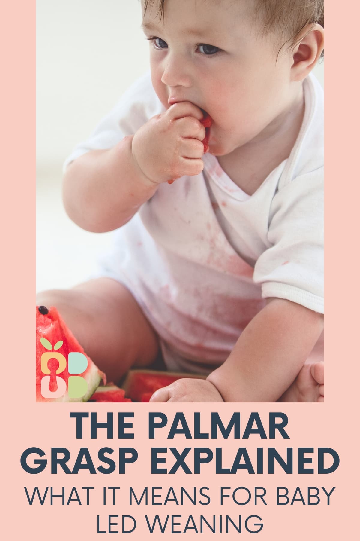 baby using palmar grasp to put watermelon in his mouth with text overlay.