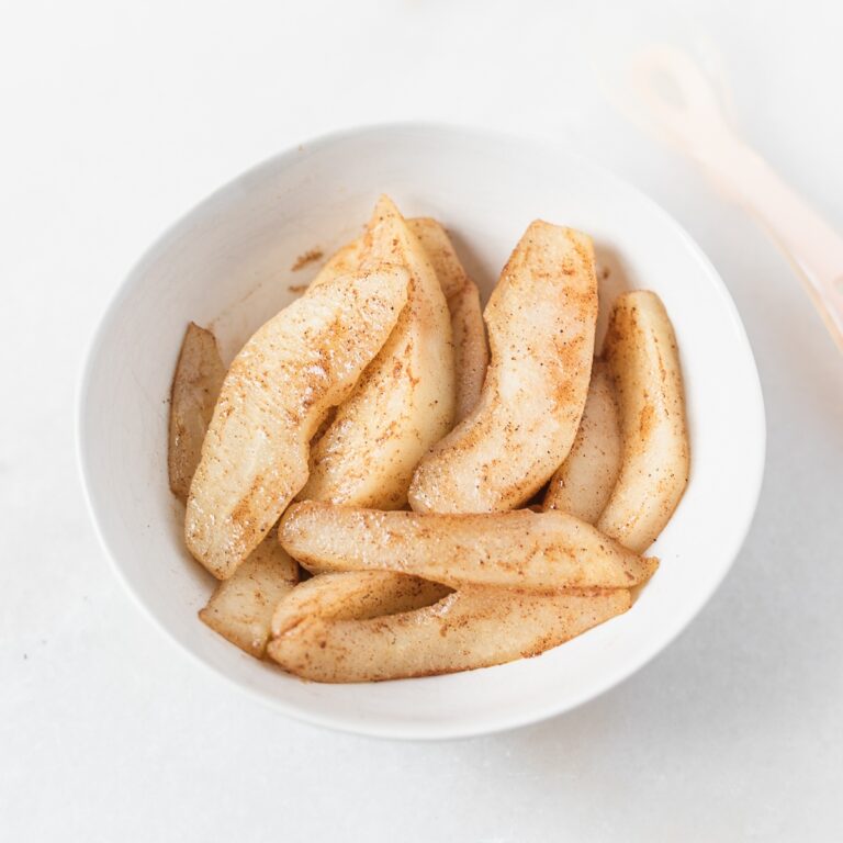 cinnamon sauted pears for baby led weaning in a white bowl.
