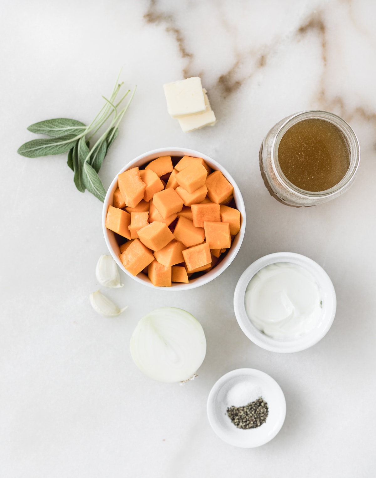 overhead view of ingredients needed to make butternut squash pasta sauce.