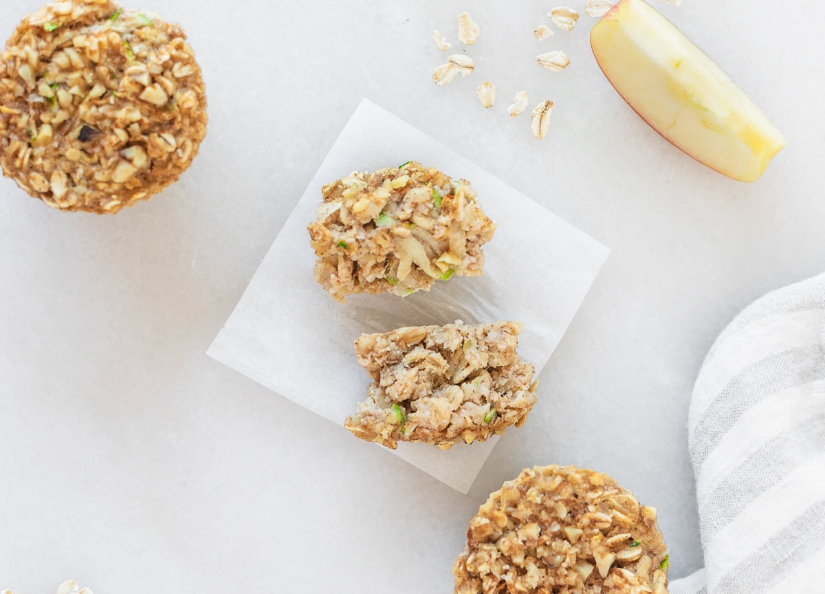 zucchini apple oatmeal cup cut into strips for baby on a square of parchment.