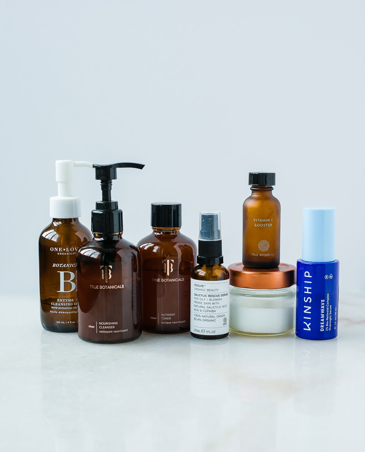 clean pregnancy skincare products lined up on a white backdrop.