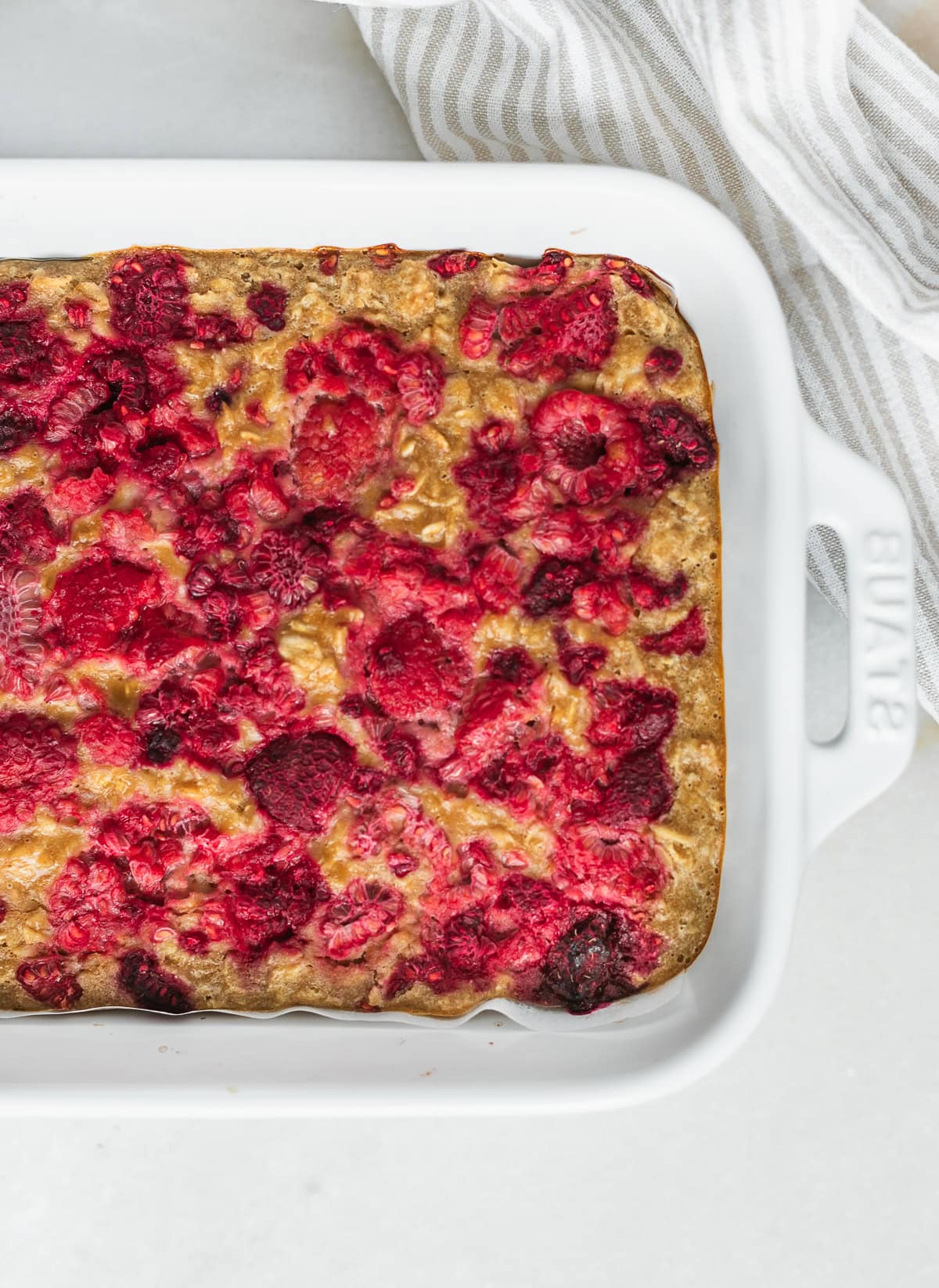 peanut butter and jelly baked oatmeal in a white dish.